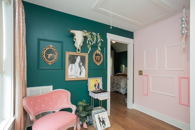 sitting room with hardwood / wood-style floors