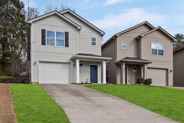 traditional home featuring a garage, driveway, board and batten siding, and a front yard