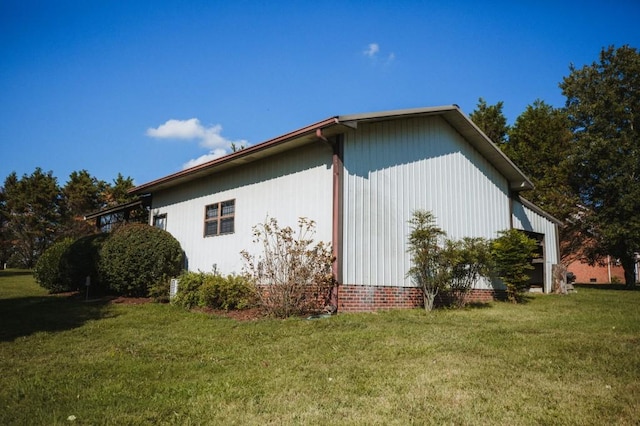 view of side of property with a yard