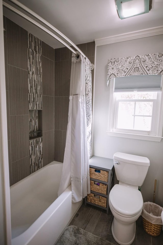 bathroom featuring toilet and shower / bathtub combination with curtain