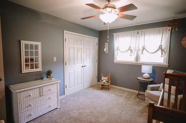 sitting room with light carpet and ceiling fan