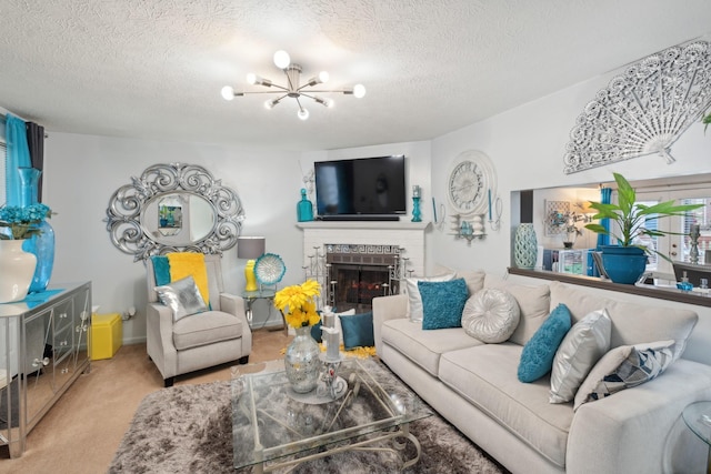 living room featuring a textured ceiling, a fireplace, light carpet, and an inviting chandelier