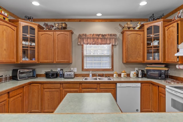 kitchen featuring sink and white appliances