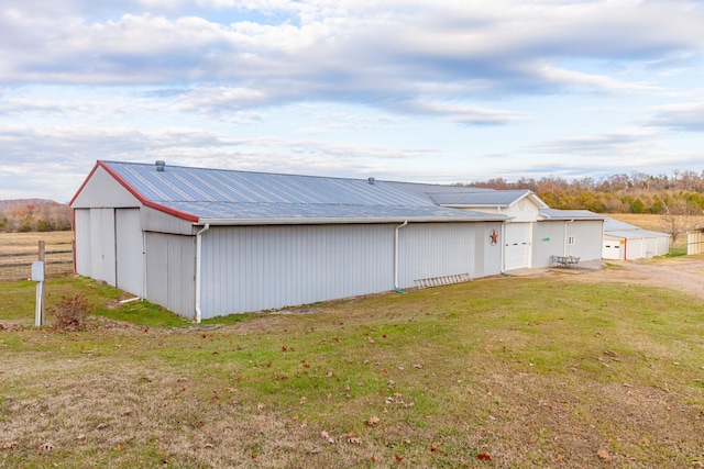 exterior space with an outbuilding and a yard