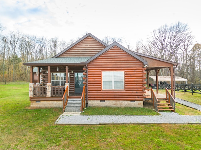 log home featuring a porch and a front yard