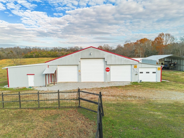 garage with a lawn