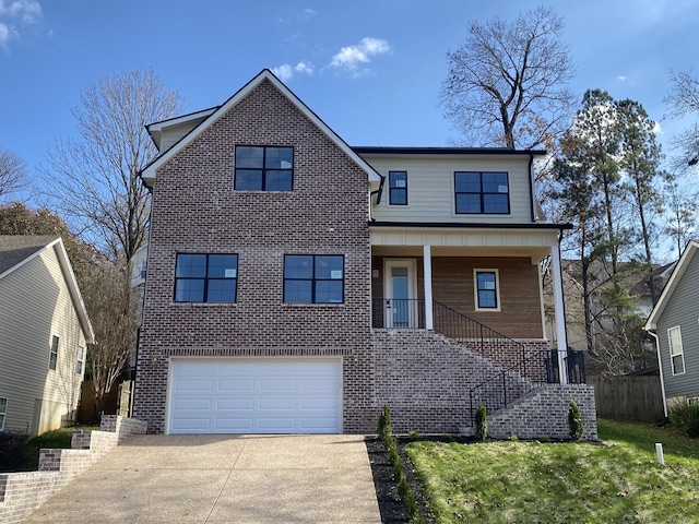 view of front of property featuring a front yard and a garage