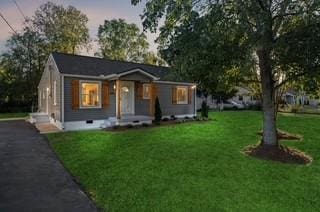 view of front of house with a yard