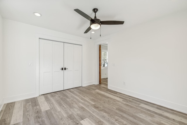 unfurnished bedroom with a closet, ceiling fan, and light hardwood / wood-style flooring