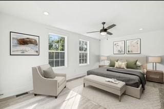 bedroom featuring light hardwood / wood-style flooring and ceiling fan