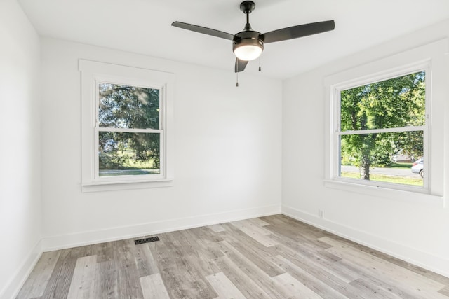 unfurnished room with ceiling fan and light wood-type flooring