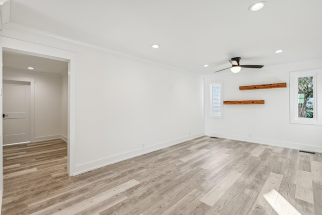 unfurnished room featuring ceiling fan, light hardwood / wood-style floors, and ornamental molding