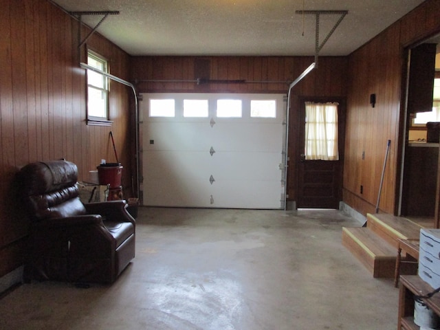 garage featuring wooden walls