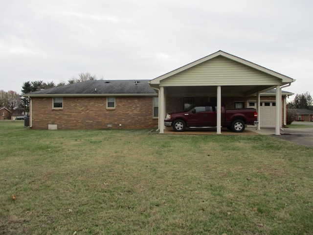 exterior space with a carport and a yard