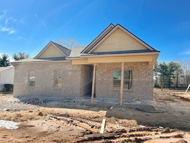 view of front facade featuring brick siding