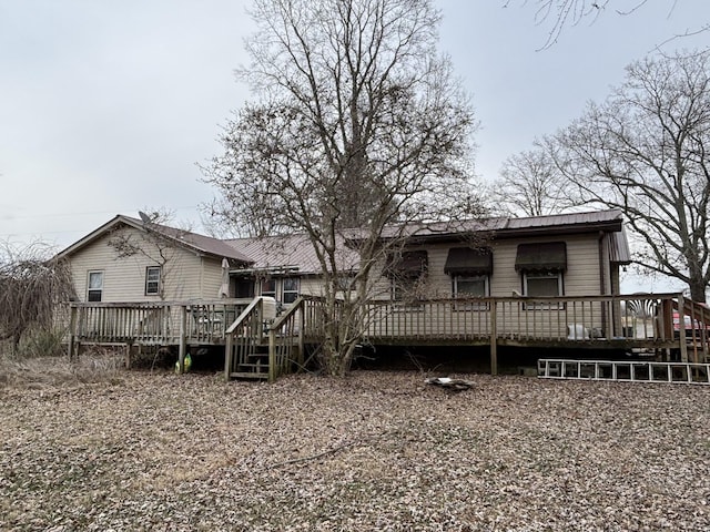 rear view of house with a deck