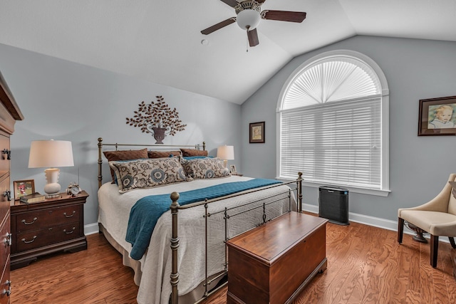 bedroom with wood-type flooring, ceiling fan, and lofted ceiling