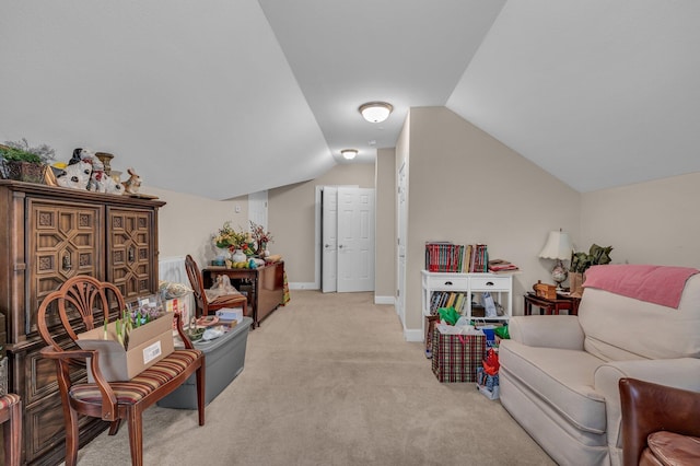 carpeted living room featuring lofted ceiling