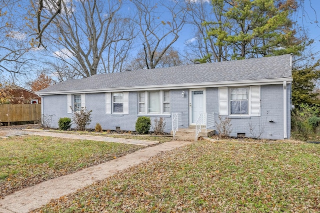 ranch-style home with a front lawn