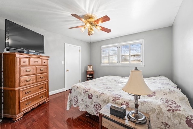 bedroom with ceiling fan and dark wood-type flooring