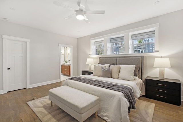 bedroom with wood-type flooring, ensuite bath, and ceiling fan