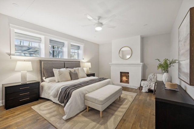 bedroom featuring dark hardwood / wood-style flooring and ceiling fan