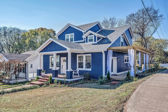 view of front of house featuring a porch and a front lawn