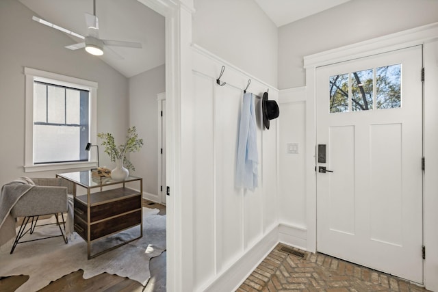 mudroom with ceiling fan and vaulted ceiling