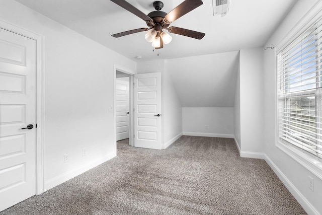 bonus room with visible vents, baseboards, a ceiling fan, vaulted ceiling, and carpet floors