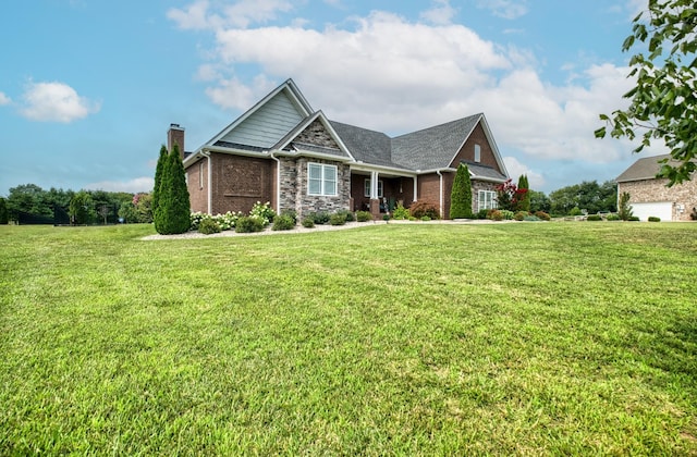 craftsman-style home featuring a front lawn