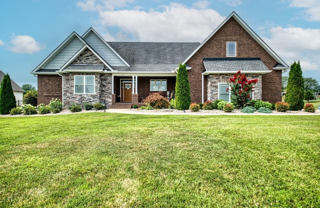 craftsman-style home featuring a front lawn