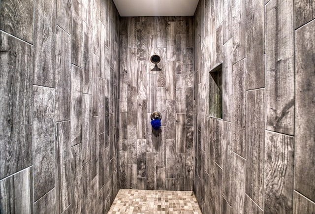 bathroom with tiled shower