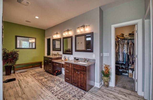 bathroom featuring vanity and hardwood / wood-style flooring