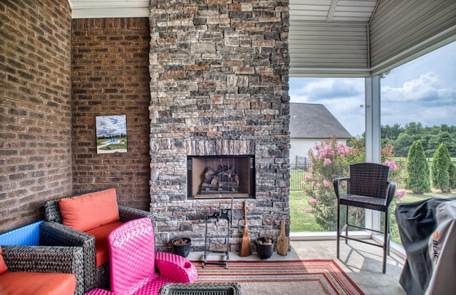 exterior space featuring a grill and an outdoor stone fireplace