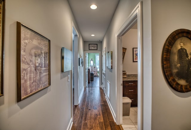 hallway with dark wood-type flooring