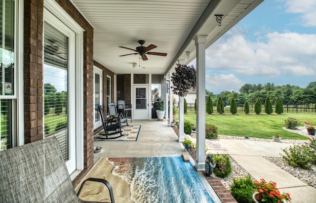 view of patio featuring ceiling fan