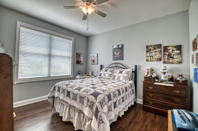 bedroom with ceiling fan and dark hardwood / wood-style flooring