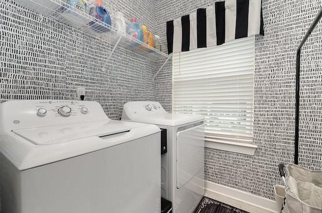 washroom with washing machine and dryer and tile walls