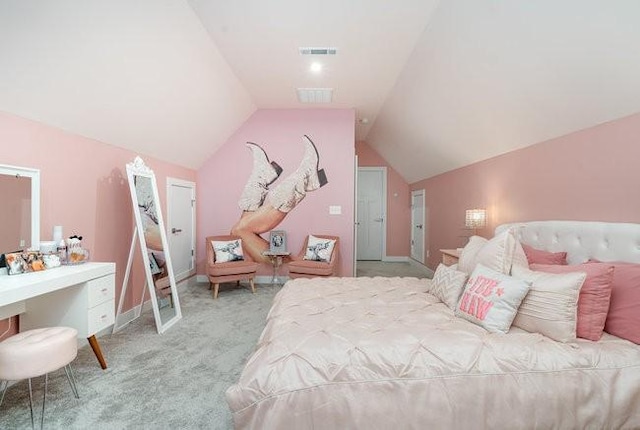 carpeted bedroom with vaulted ceiling