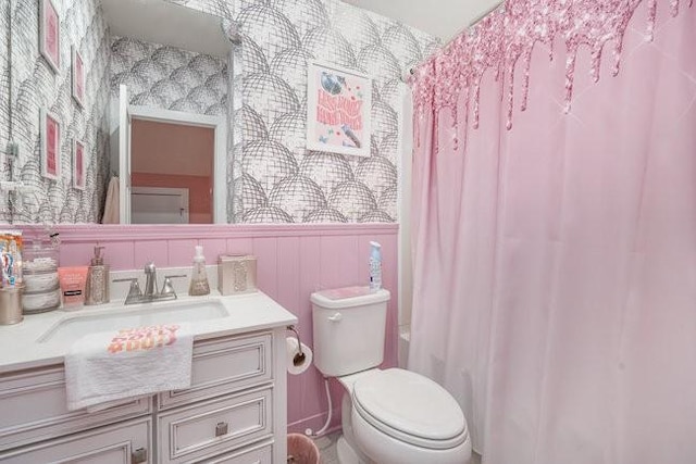 full bathroom featuring vanity, toilet, and shower / tub combo