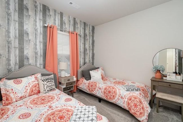 bedroom featuring dark colored carpet