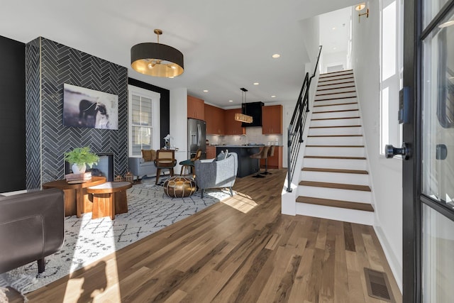 living room featuring dark hardwood / wood-style flooring and sink