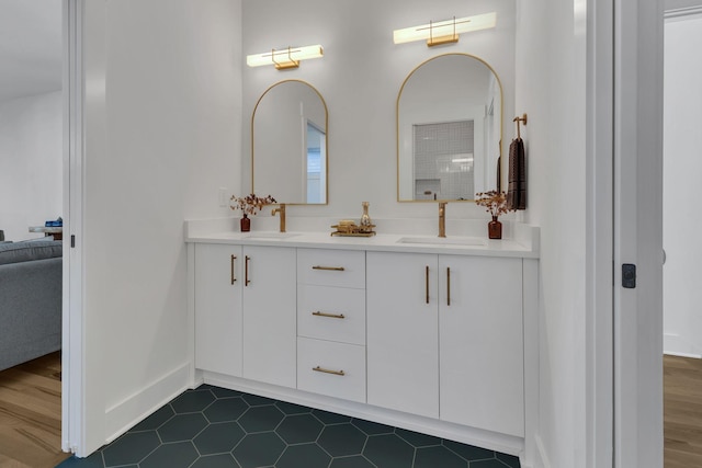 bathroom with hardwood / wood-style floors and vanity