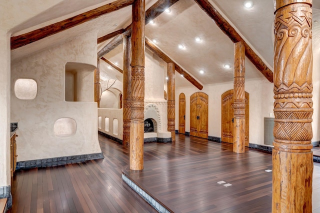 workout room with dark hardwood / wood-style flooring and vaulted ceiling