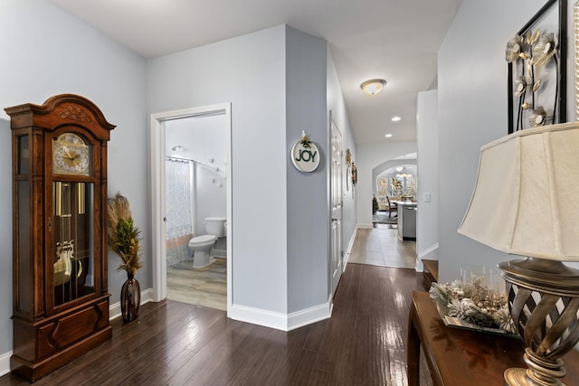 hall with dark hardwood / wood-style floors