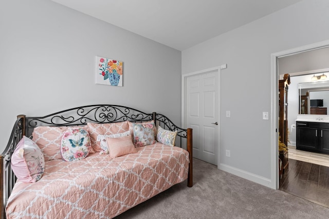 bedroom with carpet flooring and ensuite bathroom