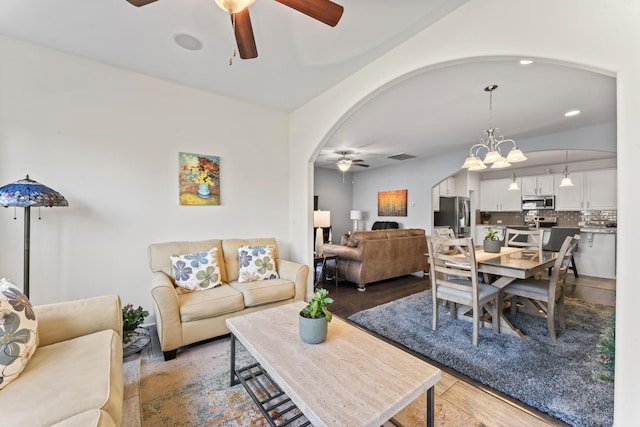 living room featuring light hardwood / wood-style flooring and an inviting chandelier