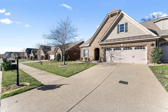 view of front facade featuring a front lawn and a garage