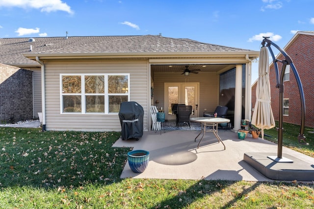 back of house with ceiling fan, a patio area, and a yard