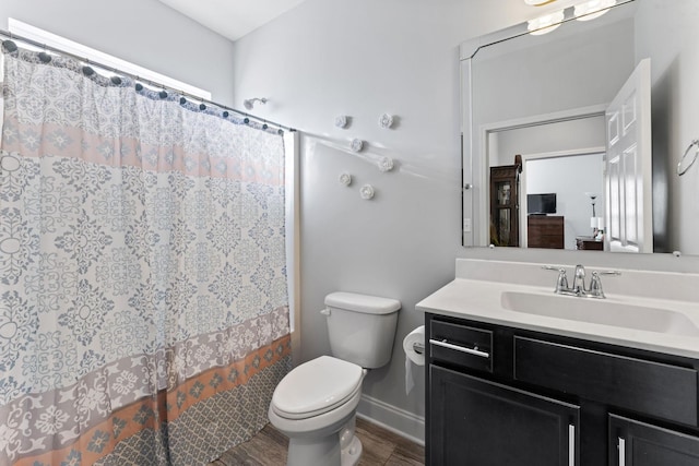 bathroom with vanity, curtained shower, toilet, and wood-type flooring